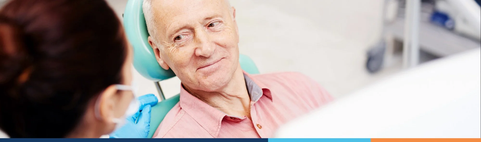 dentist with senior patient